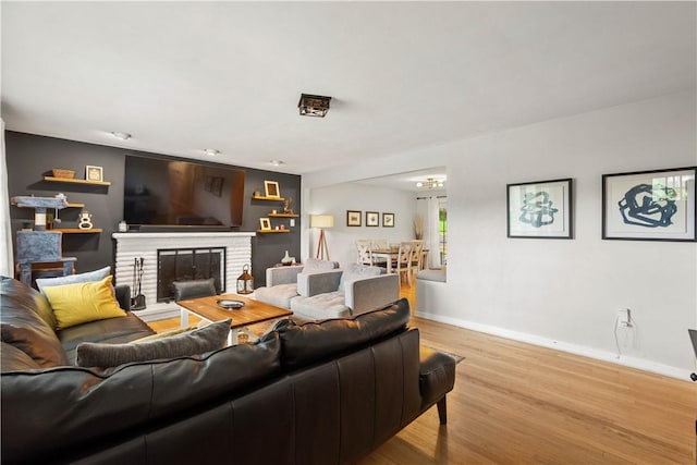 1306 Cochran Rd, Mt Lebanon, PA 15243 - living room featuring light wood-style flooring, baseboards, and a fireplace