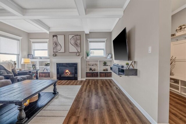 2623 Arno Dr, Oakdale, PA 15071 - living area with beamed ceiling, a healthy amount of sunlight, a glass covered fireplace, and wood finished floors