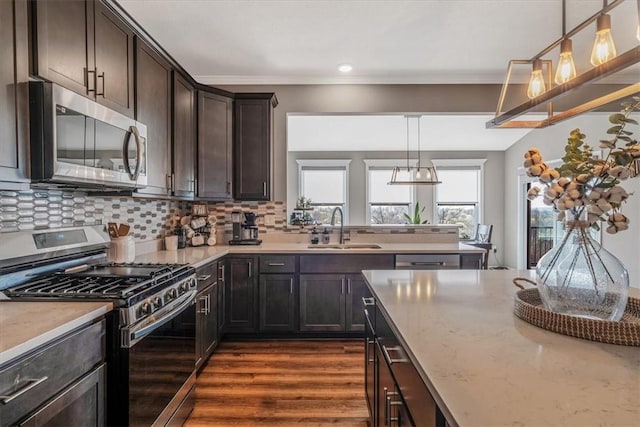 2623 Arno Dr, Oakdale, PA 15071 - kitchen featuring a sink, tasteful backsplash, dark wood-type flooring, dark brown cabinets, and appliances with stainless steel finishes