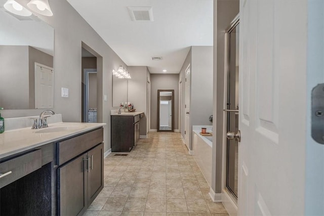 2623 Arno Dr, Oakdale, PA 15071 - full bathroom with a sink, two vanities, a bath, and visible vents