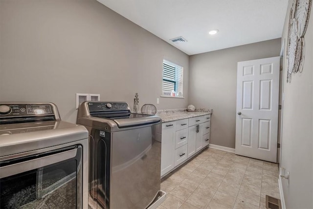 2623 Arno Dr, Oakdale, PA 15071 - laundry area with light tile patterned floors, washer and dryer, visible vents, and cabinet space