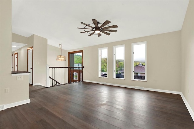 43 Mckrell Rd, West Deer, PA 15076 - unfurnished living room featuring lofted ceiling, baseboards, dark wood finished floors, ceiling fan, and visible vents