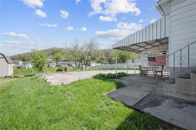view of yard featuring a patio area and fence