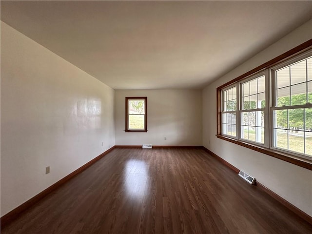 1960 E End Rd, Shippenville, PA 16254 - empty room with baseboards, visible vents, and dark wood-type flooring
