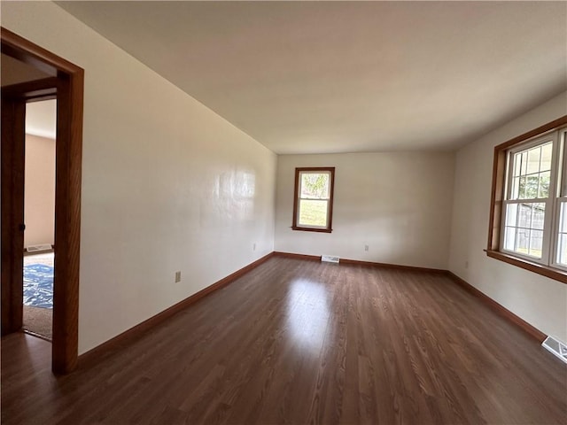 1960 E End Rd, Shippenville, PA 16254 - empty room with dark wood finished floors, visible vents, and baseboards