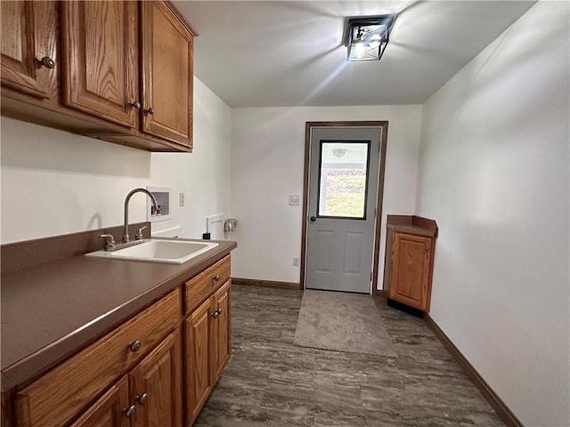 1960 E End Rd, Shippenville, PA 16254 - washroom featuring baseboards, hookup for a washing machine, a sink, dark wood-type flooring, and cabinet space
