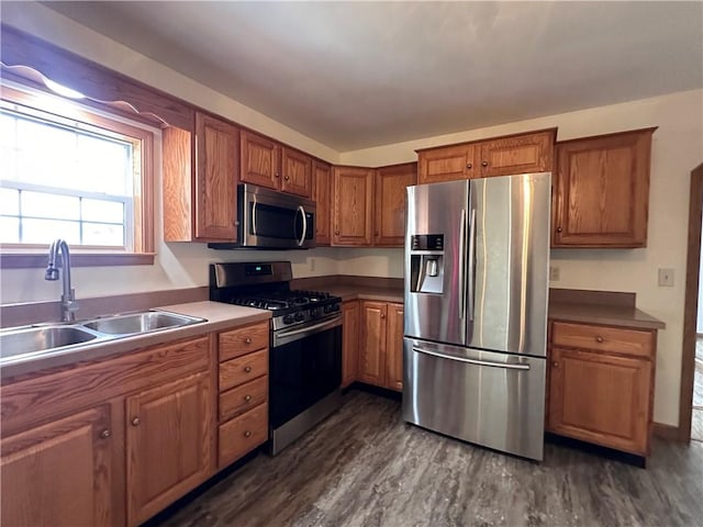 1960 E End Rd, Shippenville, PA 16254 - kitchen featuring stainless steel appliances, brown cabinetry, dark wood-type flooring, and a sink