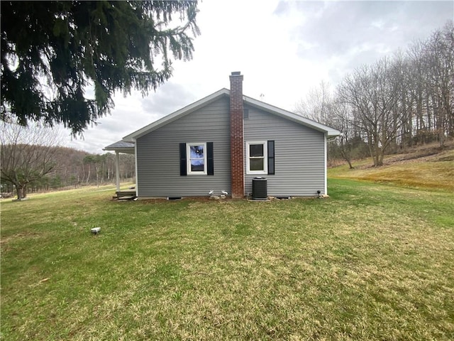 1960 E End Rd, Shippenville, PA 16254 - back of property featuring cooling unit, a chimney, and a lawn