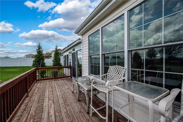 wooden terrace featuring fence