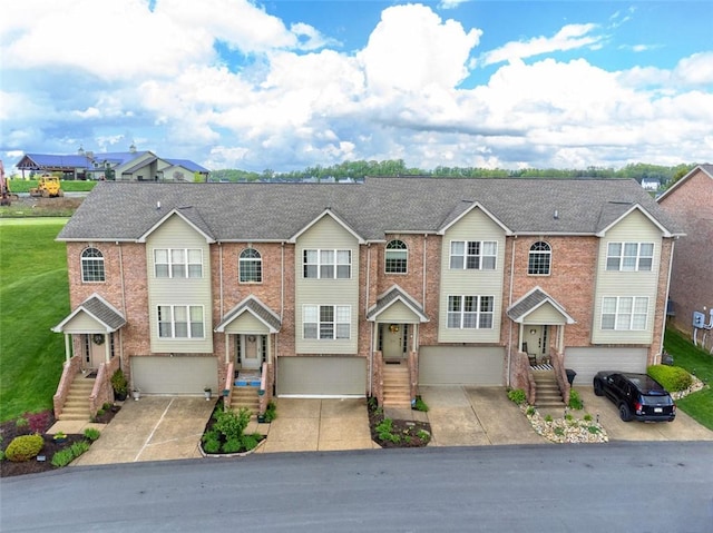 1004 Augusta Ln, Penn Twp Wml, PA 15644 - multi unit property featuring an attached garage, brick siding, and driveway