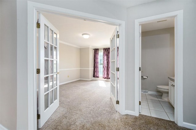 1004 Augusta Ln, Penn Twp Wml, PA 15644 - hall with french doors, light colored carpet, baseboards, crown molding, and light tile patterned floors