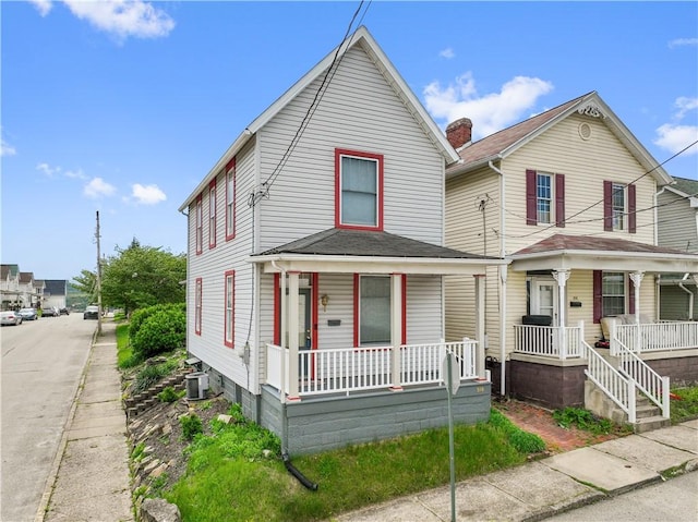 view of front of property featuring covered porch and central air condition unit