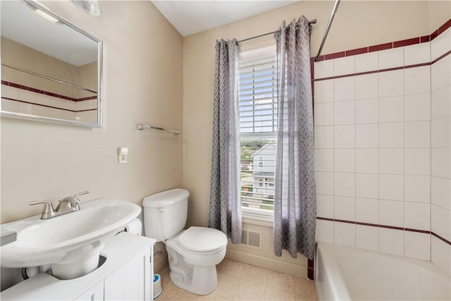 bathroom with bathing tub / shower combination, toilet, a wealth of natural light, and visible vents
