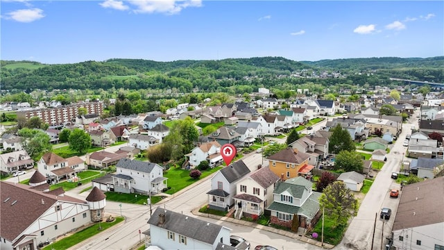 aerial view with a wooded view and a residential view