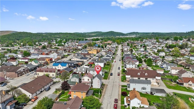 drone / aerial view featuring a mountain view and a residential view