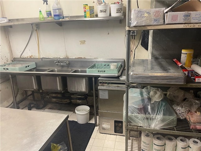 557 Mckean Ave, Donora, PA 15033 - kitchen with light tile patterned flooring
