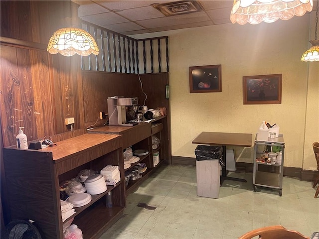 557 Mckean Ave, Donora, PA 15033 - home office with a paneled ceiling, baseboards, and wood walls