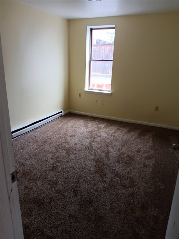 557 Mckean Ave, Donora, PA 15033 - spare room featuring baseboard heating, carpet, and baseboards