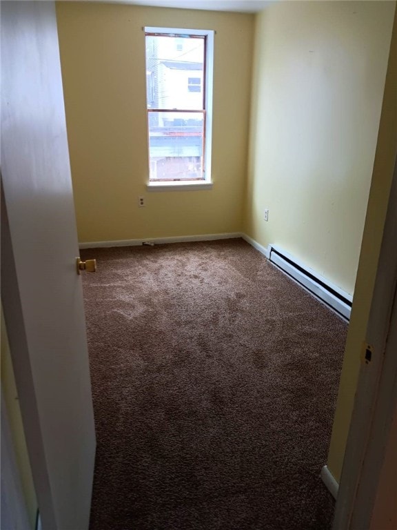557 Mckean Ave, Donora, PA 15033 - spare room featuring a baseboard radiator, carpet, and baseboards