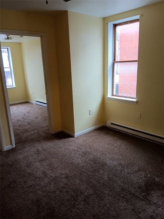 557 Mckean Ave, Donora, PA 15033 - spare room featuring carpet floors, a baseboard radiator, baseboards, and ceiling fan