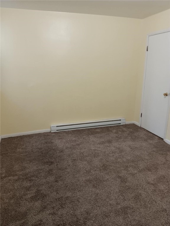 557 Mckean Ave, Donora, PA 15033 - empty room with a baseboard radiator, carpet, and baseboards