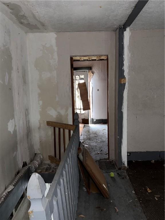 misc room with an upstairs landing
