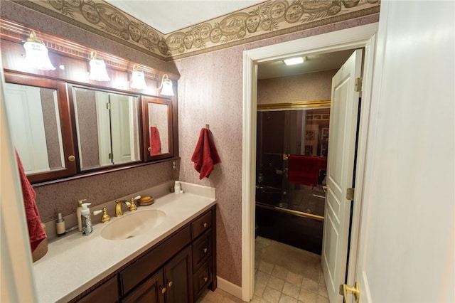 bathroom featuring vanity, wallpapered walls, and tile patterned flooring