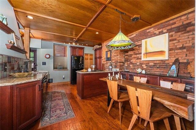 2220 Sarah St, South Side, PA 15203 - dining area with wooden ceiling, wood finished floors, brick wall, and ceiling fan