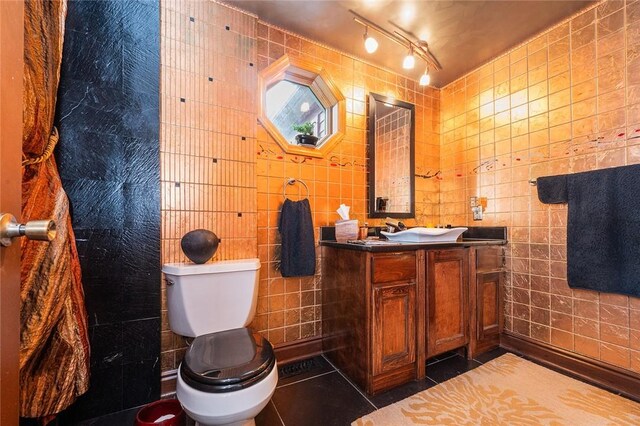 2220 Sarah St, South Side, PA 15203 - bathroom featuring tile walls, tile patterned flooring, toilet, and vanity