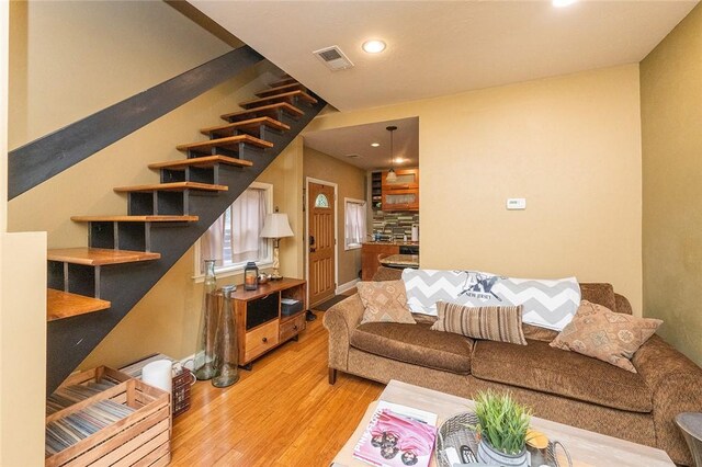 2220 Sarah St, South Side, PA 15203 - living room with wood finished floors, recessed lighting, and stairway