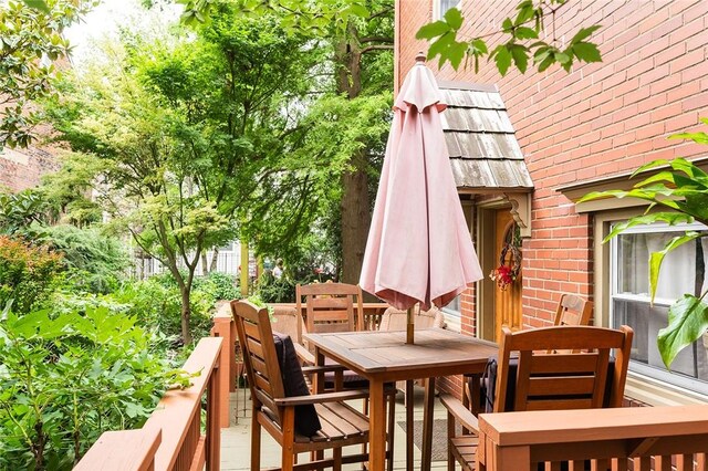 2220 Sarah St, South Side, PA 15203 - view of wooden balcony with outdoor dining area and a wooden deck