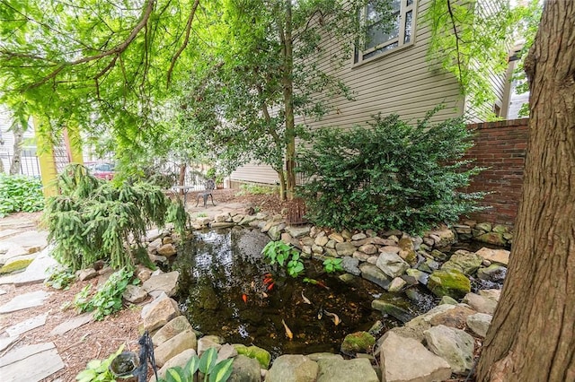 2220 Sarah St, South Side, PA 15203 - view of yard featuring fence and a small pond