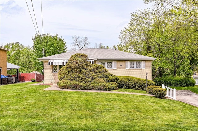 1079 Hedy Lynn Dr, North Huntingdon, PA 15642 - view of front of house with brick siding and a front yard