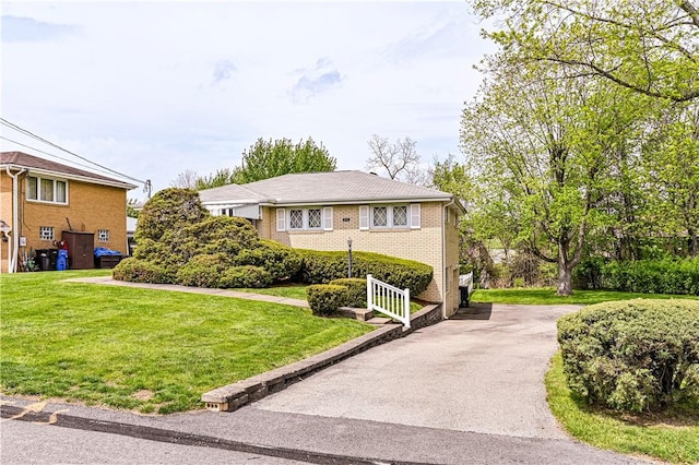 1079 Hedy Lynn Dr, North Huntingdon, PA 15642 - view of front of property featuring brick siding and a front yard