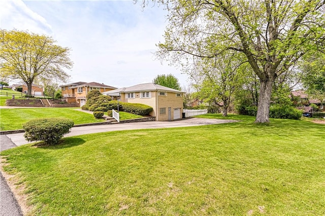 1079 Hedy Lynn Dr, North Huntingdon, PA 15642 - view of green lawn featuring a garage and driveway