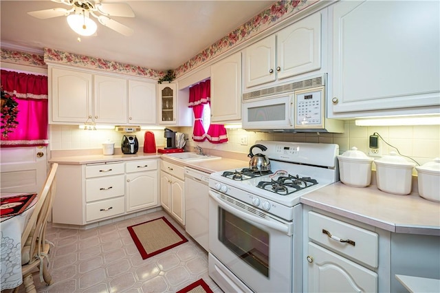 1079 Hedy Lynn Dr, North Huntingdon, PA 15642 - kitchen featuring white appliances, a sink, tasteful backsplash, a ceiling fan, and light countertops