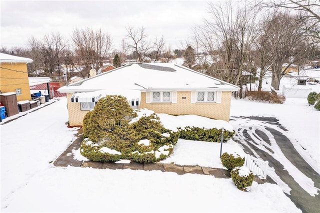 1079 Hedy Lynn Dr, North Huntingdon, PA 15642 - snow covered house featuring brick siding