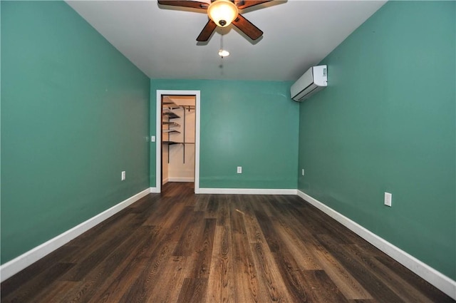 3053 Scheinbach Rd, Jefferson Hills, PA 15332 - unfurnished bedroom featuring a wall mounted AC, baseboards, dark wood-type flooring, and ceiling fan