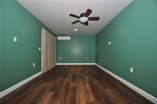 3053 Scheinbach Rd, Jefferson Hills, PA 15332 - unfurnished room featuring a ceiling fan, an AC wall unit, wood finished floors, and baseboards