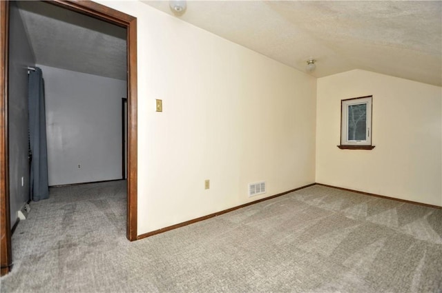 3053 Scheinbach Rd, Jefferson Hills, PA 15332 - additional living space with carpet flooring, lofted ceiling, baseboards, and a textured ceiling