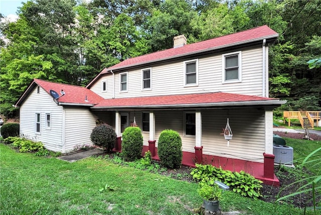 3053 Scheinbach Rd, Jefferson Hills, PA 15332 - view of front of home with covered porch, a front lawn, a chimney, and view of scattered trees
