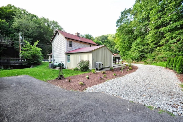 3053 Scheinbach Rd, Jefferson Hills, PA 15332 - view of home's exterior featuring a lawn and a chimney