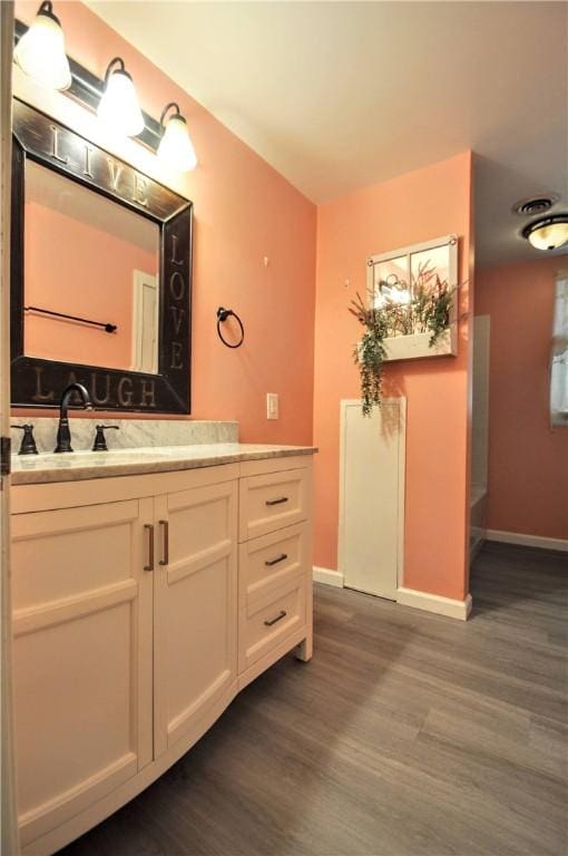 3053 Scheinbach Rd, Jefferson Hills, PA 15332 - bathroom with wood finished floors, vanity, and baseboards