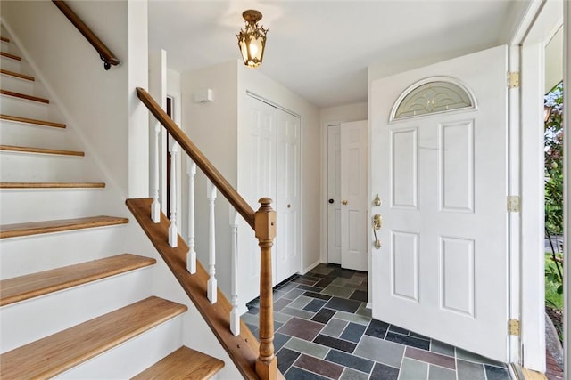 179 Kelvington Dr, Monroeville, PA 15146 - foyer with stone finish floors, stairway, plenty of natural light, and baseboards