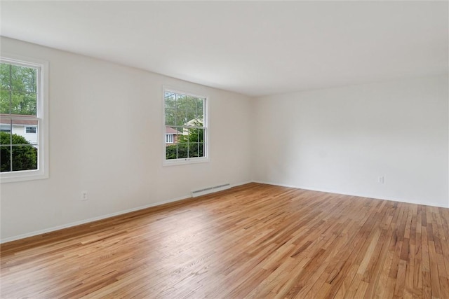 179 Kelvington Dr, Monroeville, PA 15146 - unfurnished room with plenty of natural light, light wood-style floors, a baseboard radiator, and baseboards