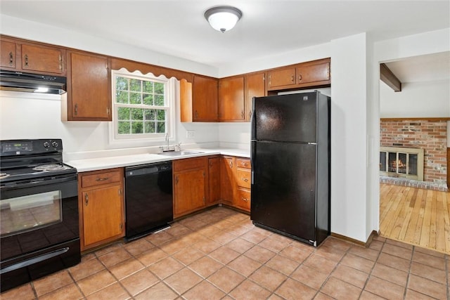 179 Kelvington Dr, Monroeville, PA 15146 - kitchen featuring black appliances, a sink, under cabinet range hood, and light countertops