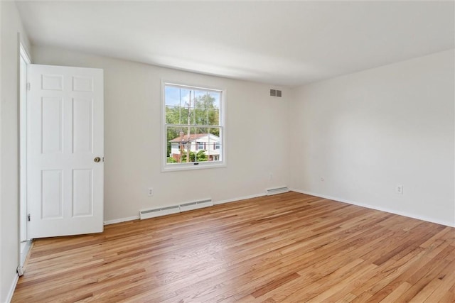 179 Kelvington Dr, Monroeville, PA 15146 - empty room featuring baseboard heating, light wood-style flooring, and baseboards