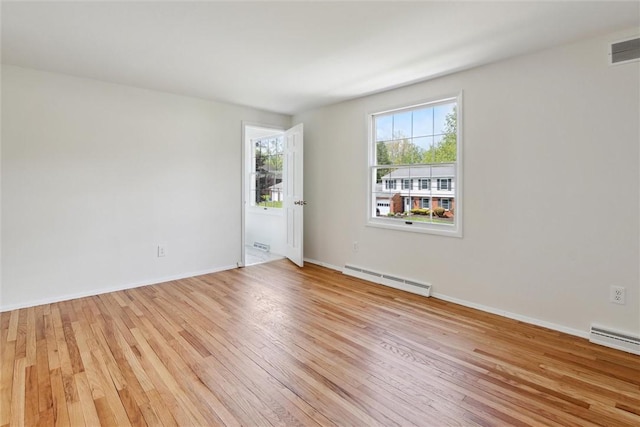 179 Kelvington Dr, Monroeville, PA 15146 - unfurnished room featuring baseboard heating, light wood-type flooring, and baseboards