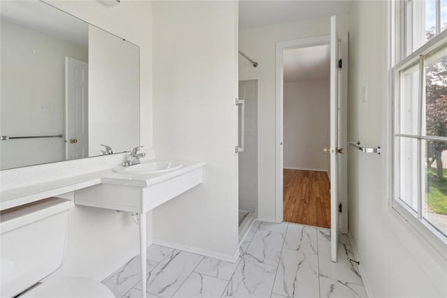 179 Kelvington Dr, Monroeville, PA 15146 - bathroom featuring a shower stall, a sink, marble finish flooring, and baseboards