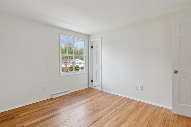 179 Kelvington Dr, Monroeville, PA 15146 - spare room featuring light wood-type flooring, a baseboard radiator, and baseboards